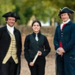 A student competitor with James Madison and Thomas Jefferson